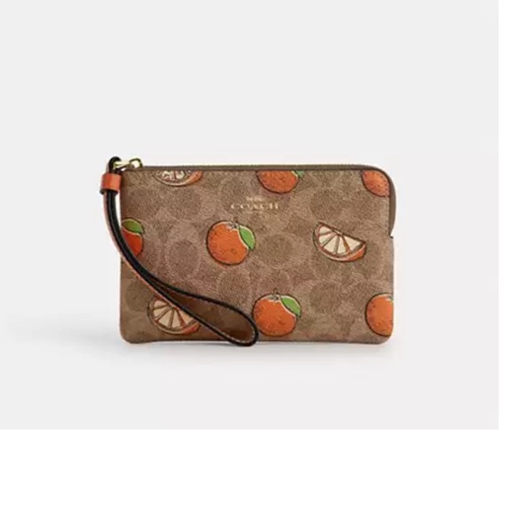 Coach Handbags - 🍊Coach New  Tan Wristlet with Orange print corner zip wallet